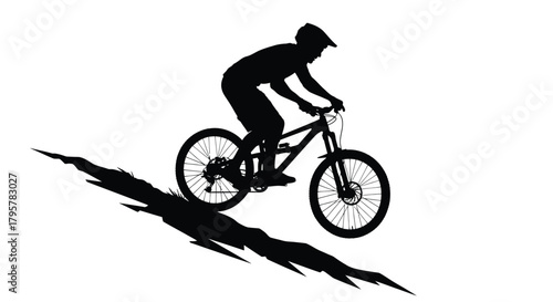 Silhouette of cyclist riding downhill bicycle mountain