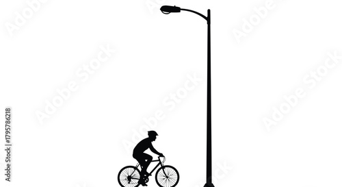 Cyclist beside street lamp bicycle helmet