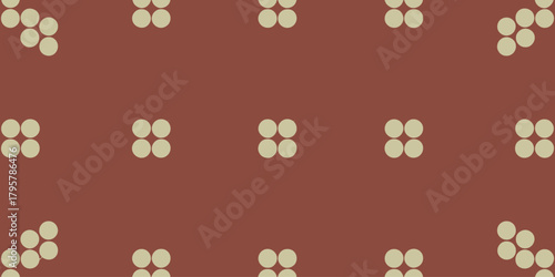 A pattern of grouped light beige circles on a reddish brown background forming a geometric design