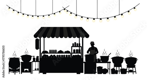 Food stall vendor cooking under string lights pots