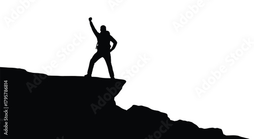 Hiker celebrates on cliff edge silhouette mountain