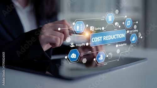 A business professional engages with digital tools to strategize cost reduction, emphasizing budgeting, frugality, and efficient spending for organizational success. Tessel