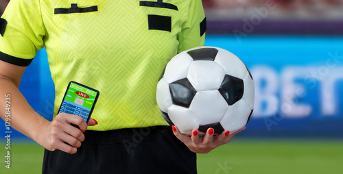 mobile phone in hand of referee