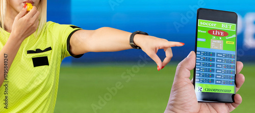 mobile phone in hand of referee