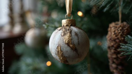 Wallpaper Mural Elegant linen Christmas ornament with gold leaf accents hanging on a tree Torontodigital.ca