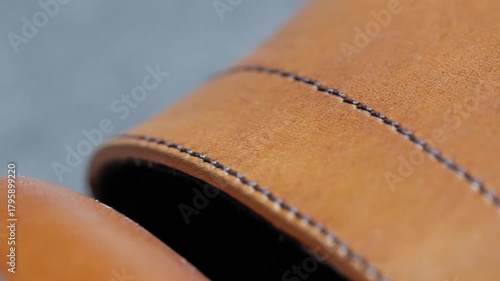 Close up view of classic leather shoe stitching