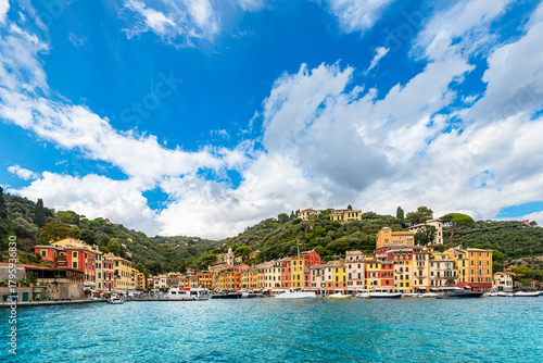 Fototapeta Naklejka Na Ścianę i Meble -  Scenic view of the old fishermen village of Portofino on Italian riviera with Ligurian sea and dramatic sky