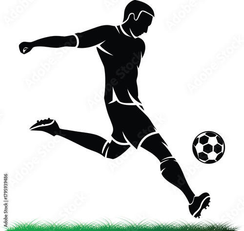 Silhouette of soccer player kicking a football powerfully