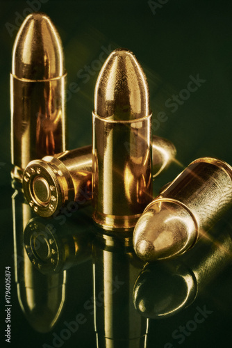 9MM Gold Copper Bullets Macro Still Life Shot on Green Glass with Reflections 