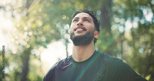 Thinking, hiking and man in woods, fitness and daydreaming with environment, smile and countryside. Happy, hiker or healthy person in forest, contemplation and adventure with eco tourism and trekking