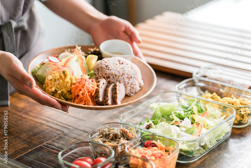 A housewife preparing a one-plate lunch in the kitchen
