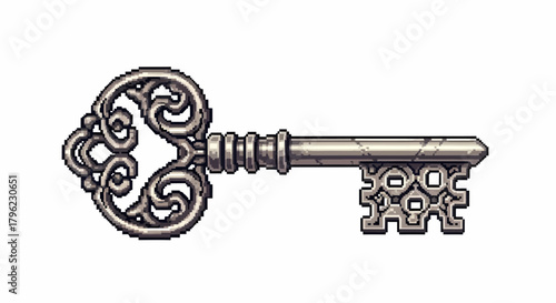 An intricately designed antique silver skeleton key with ornate scrollwork and a textured finish.