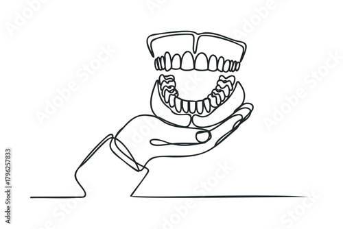 Hand holding artificial teeth in single line drawing