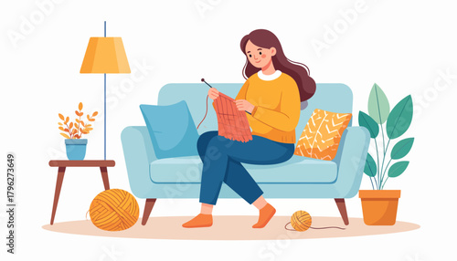 Young woman enjoying a relaxing afternoon knitting on her cozy sofa at home, surrounded by warm decor and yarn, embracing a peaceful and creative hobby indoors