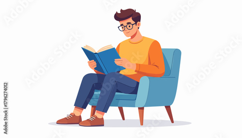A young, bespectacled man finds comfort and knowledge while engrossed in a book, seated in a stylish blue armchair on an isolated background