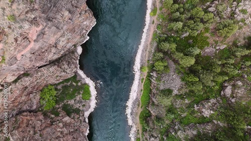 Drone flight through a canyon over the Gunnison River below in the high country of Colorado