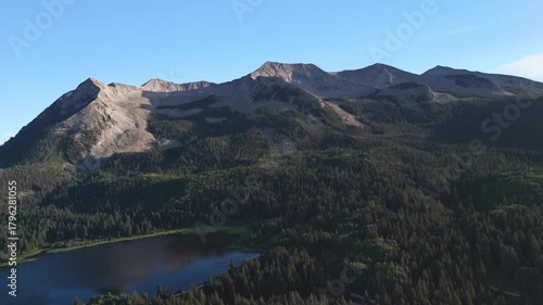 Drone flight at sunset over an alpine lake near Kebler Pass, in Crested Butte, Colorado