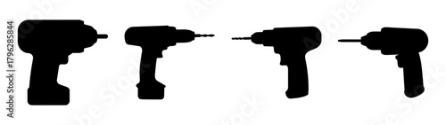 Row of four black cordless power drills lined up side by side