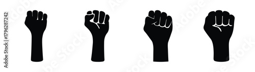Four fists raised in solidarity showing unity strength and protest symbols
