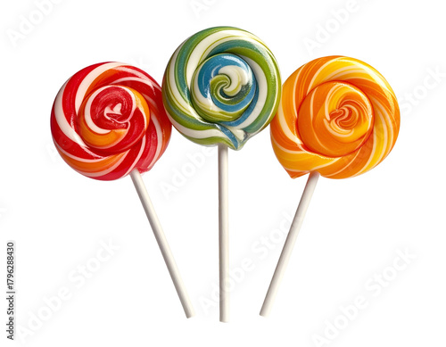 Three colorful swirled lollipops on white sticks against black