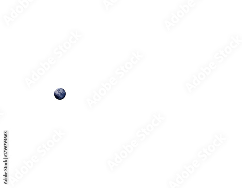 Distant celestial body illuminated against deep blackness