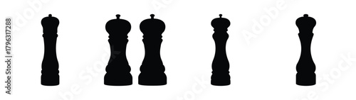 Collection of elegant black pepper grinders and salt mills for culinary use and kitchen decor