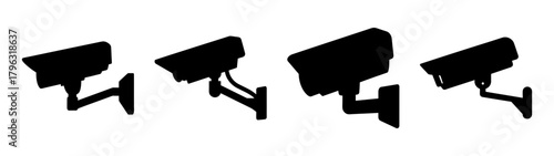 Set of four black security cameras in silhouette surveillance technology concepts
