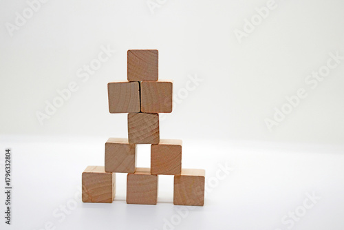Pyramid of Wooden Toy Blocks on White Background