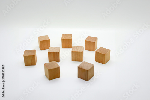 Scattered Wooden Toy Blocks on White Background