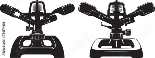 Two garden sprinklers in black silhouette