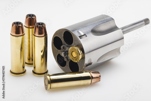 .38 special gun bullets with stainless revolver cylinder on white background