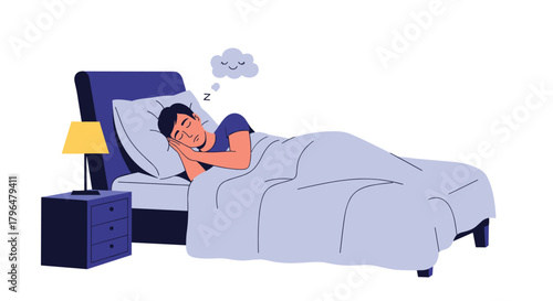 Young man sleeping peacefully in his bed, having a pleasant dream, with a lamp on the bedside table.