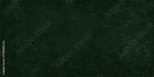 Dark grunge green chalkboard texture background with blank vintage rough board pattern