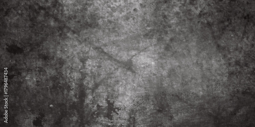 A blurred grayscale image presents a dark and textured surface with indistinct shapes and a cross like formation
