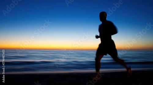 Silhouette of running man, athletic figure at sunset by the sea, with vibrant sky and calm ocean, close-up, copy space