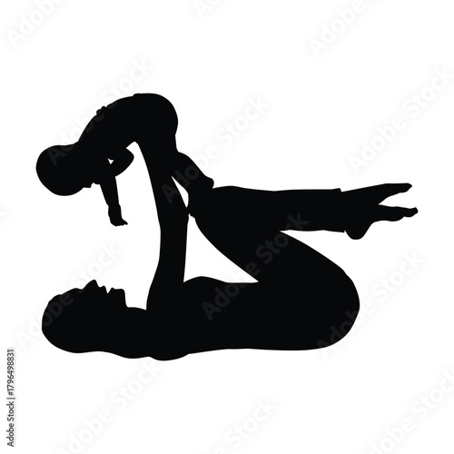 Silhouette of a mother on her back, lifting her happy baby high with her hands and feet. This image symbolizes motherhood, playful bonding, family love, and postnatal exercise or fitness.