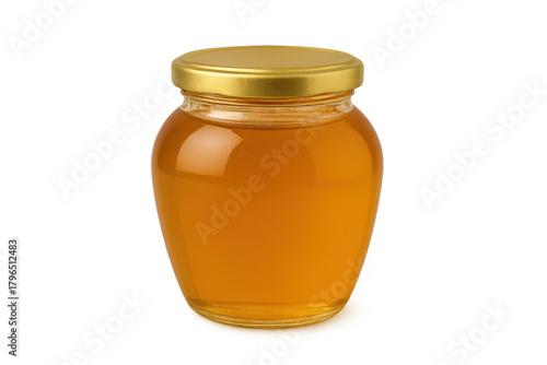 Golden honey in a glass jar with a lid