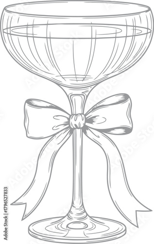 Elegant champagne coupe glass adorned with a festive ribbon bow