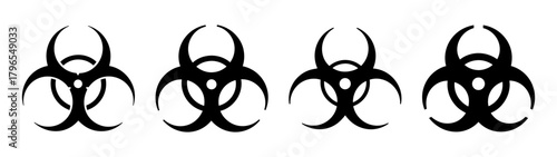 Four black biohazard symbols displayed in a row on a white canvas representing danger and contamination