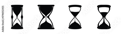Four black hourglasses depicting passing time and measurement