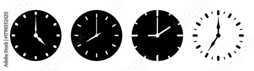Four clocks showing different times four oclock seven oclock and other times