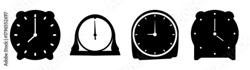 Collection of four vintage desk clocks showing different times