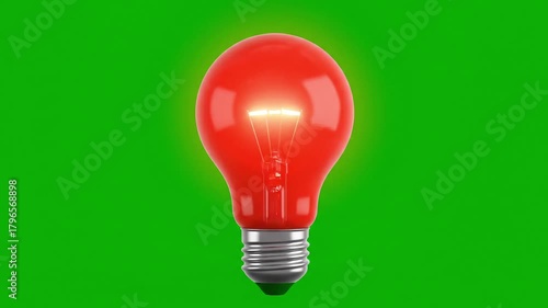 Bright red lightbulb glowing intensely against vibrant green screen backdrop, perfect for showcasing ideas, innovation, and creative energy in a modern design project