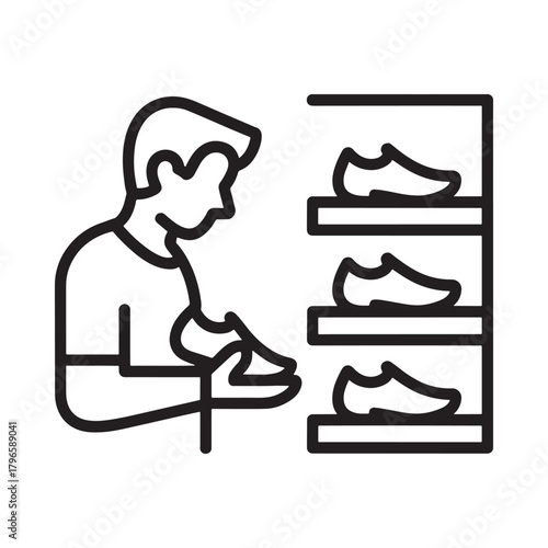Man choosing shoes from a display shelf