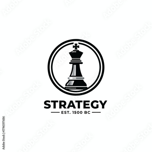 A black and white emblem featuring a chess king inside a circle, with the word "STRATEGY" below