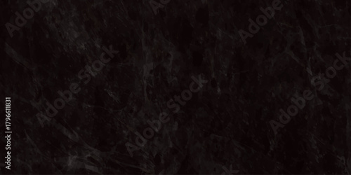 A predominantly black textured background displaying an indistinct shadowy pattern resembling wisps or dark foliage