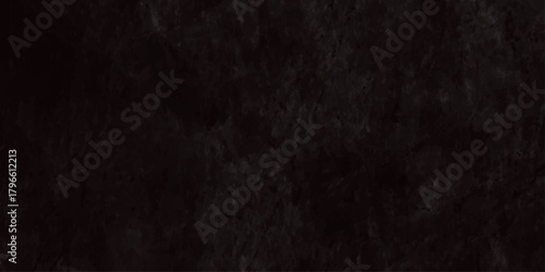 A completely black image with a slightly textured appearance offering a visual study in darkness and minimalism