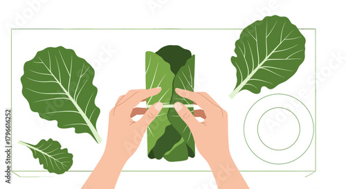 Hands Rolling Healthy Food Within Leaf Wrappings On White Surface With Greenery