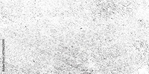 A close up view of a grainy textured surface predominantly white with subtle variations in tone and density