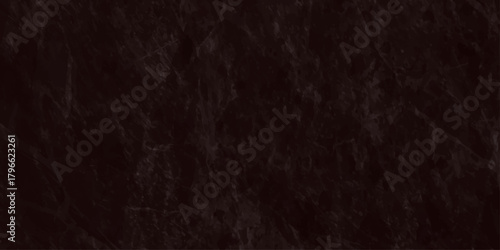 A close up view of dark textured fabric reveals a rich deep brown color and an intricate woven pattern